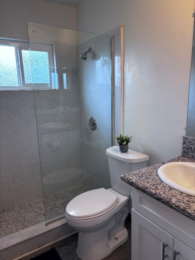 unit 38-bathroom with a tile shower - Villa Monaco Apartments