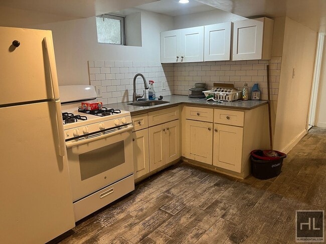 Building Photo - 2BR 1BA Lower Level All Utilities Included w/ Laundry Beside Highland Park