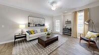 Located in Milton, GA, this single-story residence offers a thoughtfully designed layout with 1 bedroom and 2 full bathrooms. The open-concept living room greets you with wood-look flooring, crown molding, and generous natural light streaming through large windows dressed with stylish patterned curtains. A dedicated nook within the living area provides a functional workspace, adding versatility to the space.

The galley-style kitchen is appointed with granite countertops, rich wood cabinetry, stainless steel appliances, and wood-look flooring — combining a modern aesthetic with practical functionality. The living and kitchen areas flow seamlessly together.

The bedroom features plush carpet flooring, a bold accent wall, a ceiling fan, and a window allowing natural light. A dedicated closet provides organized storage.

Both bathrooms are well-finished — one showcases wood-look tile flooring, a granite vanity, and a soaking tub with a curtained shower, while the second features classic white tile surround with decorative diamond accents. An in-unit laundry room with side-by-side washer and dryer adds everyday convenience. Neutral tones throughout create a cohesive, welcoming ambiance.