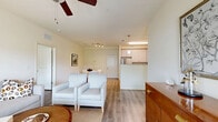 Located at 562 Centennial Pkwy in Tyler, TX, this thoughtfully designed single-story home offers three bedrooms and two bathrooms across a well-utilized floor plan. The bright and welcoming living room features wood-look flooring, a ceiling fan, and large windows that invite natural light, creating a warm and comfortable gathering space that flows seamlessly into the dining area. The kitchen is outfitted with white shaker-style cabinetry, granite-look countertops, and stainless steel appliances including a refrigerator, range, and microwave — combining style with everyday functionality. The primary bedroom is a generously sized retreat, complete with a ceiling fan, natural light from a large window, and direct access to a private en-suite bathroom. The primary bath features a granite-topped vanity with gray cabinetry, a shower/tub combination, wood-look flooring, and connects to a spacious walk-in closet lined with wire shelving. A second bathroom conveniently integrates a stacked Whirlpool washer and dryer, adding practical in-unit laundry access. The additional bedrooms are well-proportioned with ceiling fans and ample natural light. The attached garage provides secure parking and extra storage space, completing this efficiently designed and move-in-ready home.