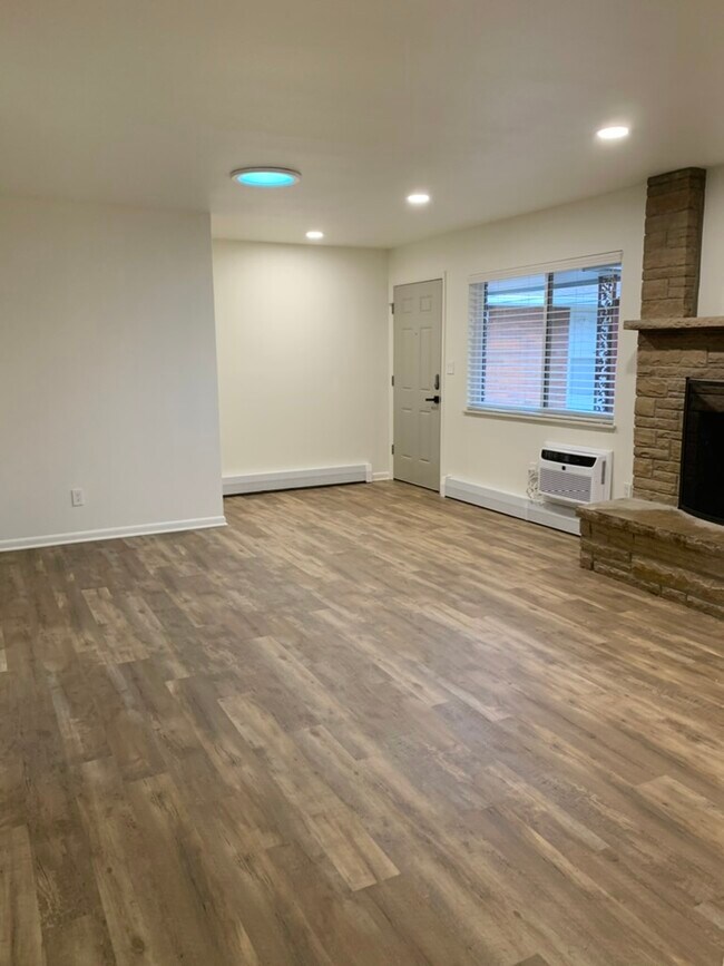 Living room/dining room with fireplace - 3117 E Locust St