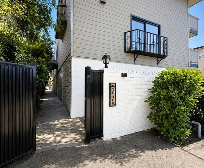 Building Photo - Spacious 2BR Condo with Central A/C, Bonus Room & Huge Storage – Walk to Burlingame Avenue