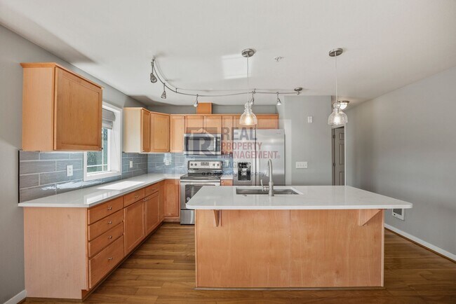 Building Photo - Check Out This Private Top-Floor 2-Bedroom, 2.0-Bath Condo in a Gated Community!