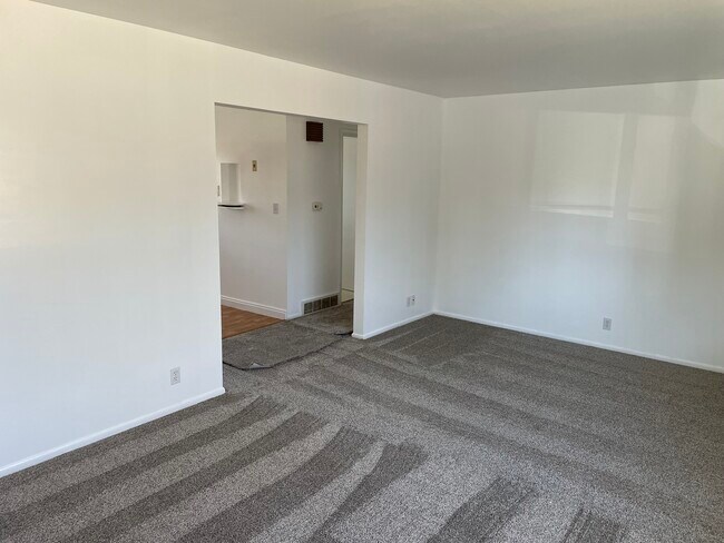 Upstairs living room leading into hallway - 565 Filmore Ave