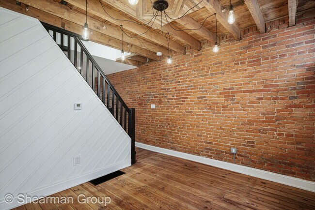 Exposed brick, refurb wood accents, modern light fixtures - 2223 E Ann St