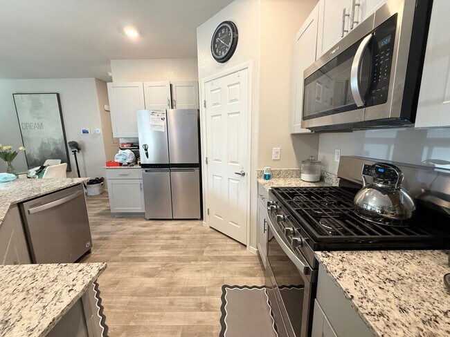 Building Photo - COMING SOON! Modern 3-Bedroom townhome with Open Layout, Community Pool & Prime Location