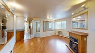 This 540 square foot single-story residence in Boulder, Colorado offers a well-designed living space with two bedrooms and one bathroom. The primary bedroom, measuring 120 square feet, provides ample space for comfort. The home's layout includes a kitchen, living room, and bathroom, efficiently utilizing the available area.

The interior showcases a blend of carpeted and hardwood flooring, with the living area featuring warm wood floors and a cozy fireplace, adding character and warmth to the space. Large windows throughout allow for natural light, enhancing the sense of openness. The kitchen, while compact, is equipped with wooden cabinetry and granite countertops, offering both functionality and style.

The bathroom is finished with clean, white tiles and includes a shower with a textured glass door. Window treatments, including blinds, offer privacy and light control. The property is equipped with baseboard heating and window air conditioning units for year-round comfort.

Strategically placed mirrors and light-colored walls contribute to a bright, airy atmosphere, making the space feel larger than its actual square footage. The home's design demonstrates a thoughtful approach to maximizing space efficiency in a smaller footprint, ideal for those seeking a low-maintenance lifestyle in the desirable Boulder area.