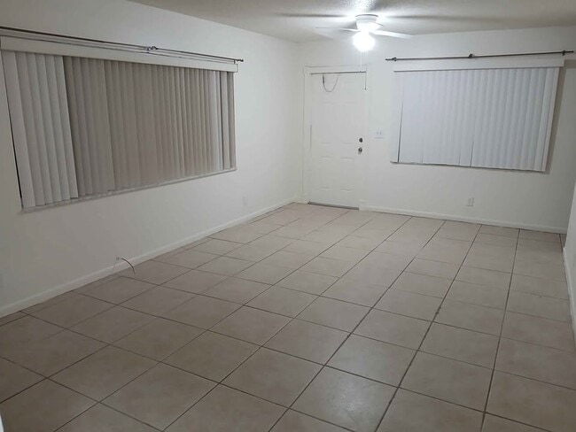 Living Room View to front door - 9021 W Highland Pines Dr