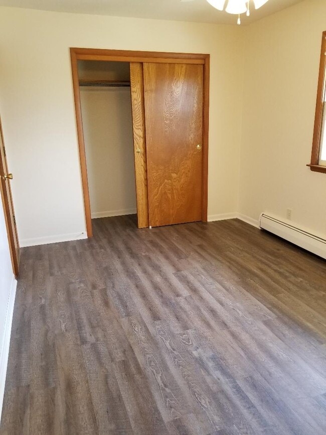 Vinyl plank floor bedroom - 110 N Maple St