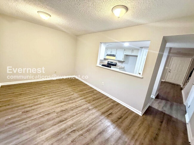 Building Photo - Spacious Townhome with Fenced Yard and Parking Space