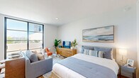 Located at 125 Quadrille Plaza Dr in the heart of West Palm Beach, FL, this thoughtfully designed studio offers a smart, open-concept layout that maximizes every square foot. Light wood-look flooring flows throughout, complementing the clean white walls and creating a warm, contemporary aesthetic.

The kitchen is efficiently appointed with warm wood cabinetry extending floor to ceiling, stainless steel appliances including a full-size refrigerator, electric range, microwave, and dishwasher, as well as white quartz countertops and a white tile backsplash. Ample upper and lower cabinetry provides generous storage.

The open living and sleeping area is bright and airy, anchored by a large picture window that frames outdoor views and fills the space with natural light. A private balcony extends the living space outdoors, offering a pleasant retreat.

The bathroom features wood-toned cabinetry, a white countertop vanity, and a tub-shower combination with clean tile surround. Two closets offer dedicated storage, while an in-unit laundry area adds everyday convenience.

The entrance leads directly into the kitchen corridor, creating a clean transition into the main living space. The overall ambiance is modern and serene, making efficient use of a well-planned footprint in a vibrant urban location.