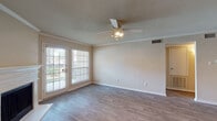 Located at 9509 E Valley Ranch Pkwy in Irving, Texas, this single-floor residence offers a well-designed layout with a blend of comfort and functionality. The living area is bright and welcoming, featuring wood-look hardwood flooring, crown molding, a textured ceiling, and a ceiling fan with integrated lighting. A fireplace serves as a focal point, while large French doors flood the space with natural light and provide access to an outdoor patio area.

The kitchen is efficiently designed with warm oak cabinetry, granite-style countertops, a stainless steel sink, and black appliances. A dedicated utility or storage closet is conveniently accessible directly from the kitchen area.

The bedrooms are carpeted for comfort and include ceiling fans and windows that invite natural light. One bedroom features a spacious walk-in closet with built-in shelving, offering ample storage. The bathroom is clean and functional, complete with a tub-shower combination, a vanity with matching cabinetry and countertop, and light tile flooring.

Throughout the residence, a neutral color palette creates a cohesive and move-in-ready aesthetic. The open connection between the living and dining areas enhances the overall sense of space, making this Irving home a practical and comfortable option.