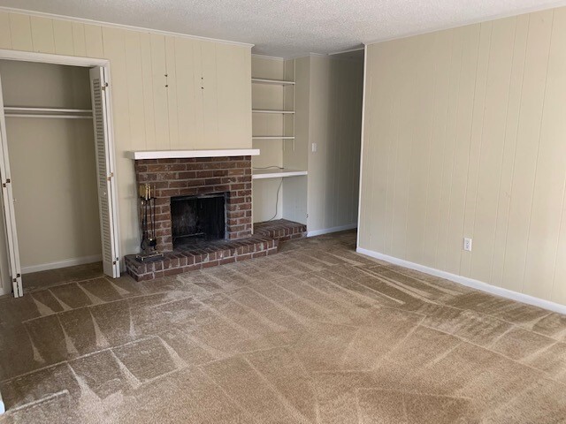 Living room with coat closet and built in bookshelves - 203 Whitehall Rd