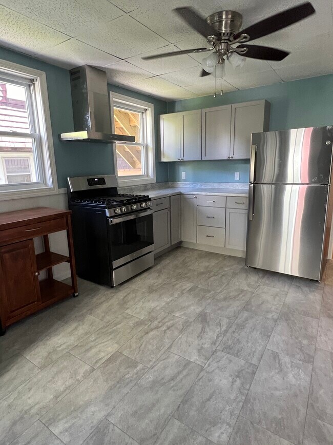 spacious kitchen with stainless steel appliances - 60 Ocean Ave