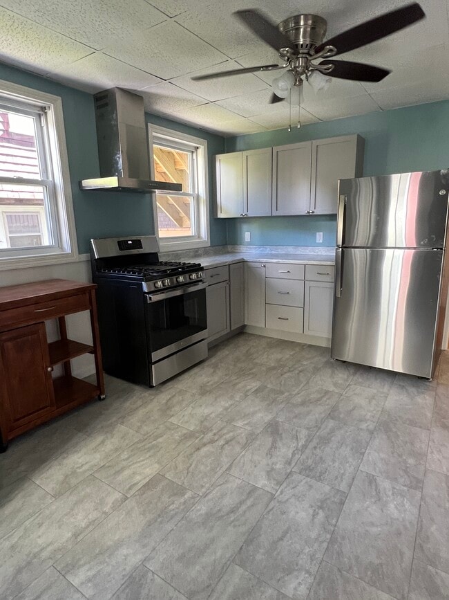 spacious kitchen with stainless steel appliances - 60 Ocean Ave