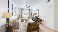 Located at 1001 Ross Ave in the heart of Dallas, TX, this single-floor residence offers two bedrooms, two bathrooms, and a thoughtfully designed layout that maximizes comfort and functionality. Light wood flooring flows throughout the home, lending a warm and cohesive feel to every room.

The kitchen is a standout feature, showcasing an expansive quartz waterfall peninsula with bar seating, white shaker cabinetry with gold hardware, and a full suite of stainless steel appliances. A decorative arched entryway connects the kitchen to the entrance foyer, adding an elegant architectural touch.

The living room is bright and welcoming, with crown molding, a ceiling fan, and a window framing views of the Dallas skyline. The space is well-proportioned for both relaxing and entertaining.

The generously sized primary bedroom features vaulted ceilings, a ceiling fan, and direct access to its own bathroom, creating a private retreat. The second bedroom is cozy and well-lit, with ample space for furnishings.

Both bathrooms are finished with clean white tile, tub-shower combinations, matte black fixtures, and light wood flooring. Additional spaces include a dedicated laundry area, hallway, entrance foyer, and two closets, rounding out a complete and practical floor plan.