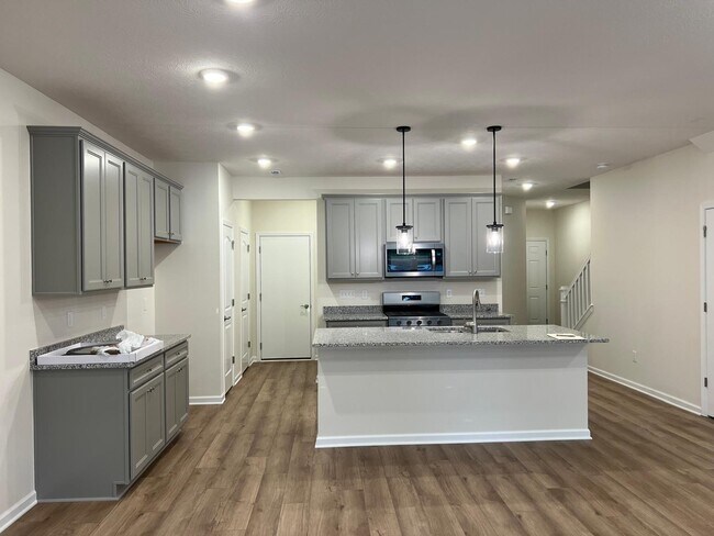 Cocina con barra de café - 6527 Wheatly Rd