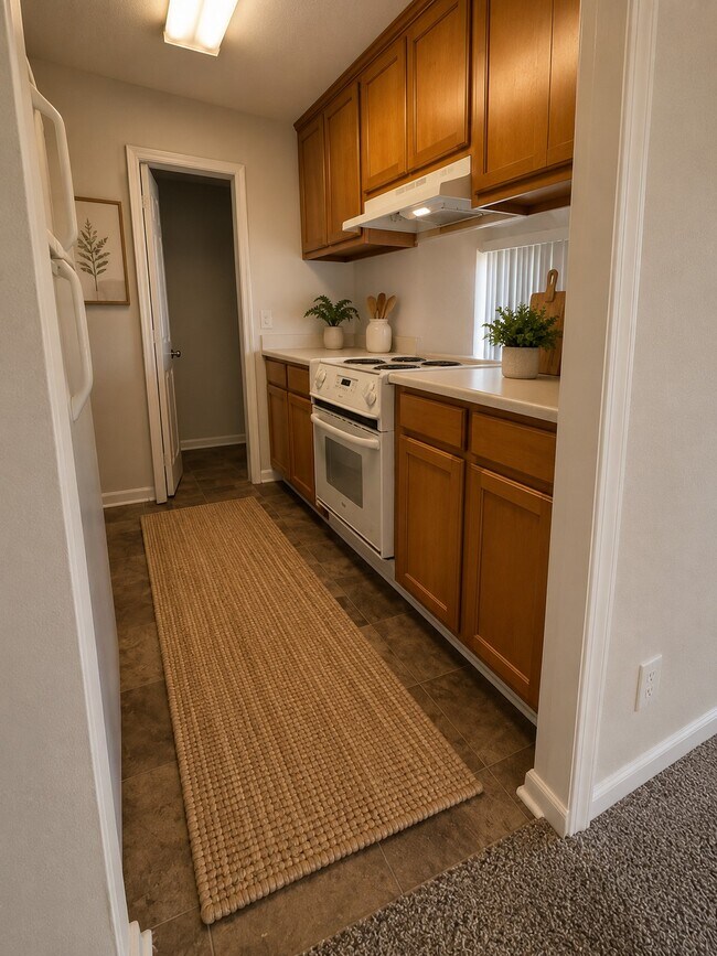 Cocina amueblada con tecnología Ai - Castlewood Apartments