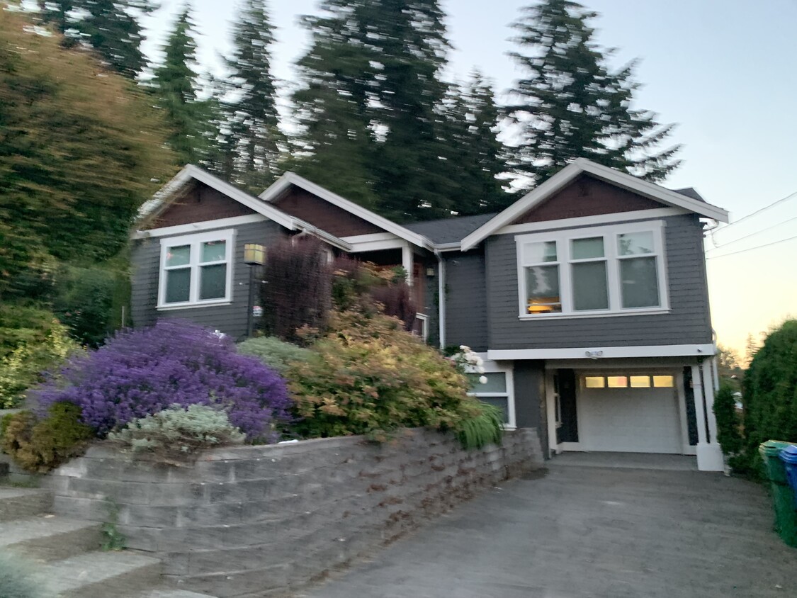 Tennant parks in lower driveway - 2332 NE 120th St