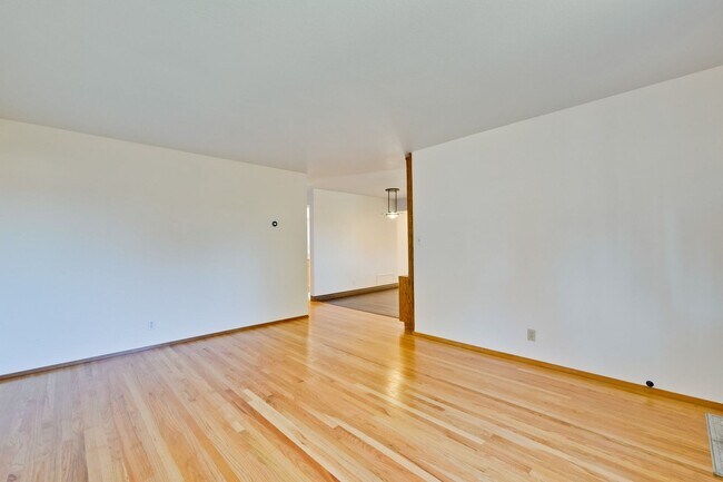 Building Photo - Newly Landscaped Backyard- Hardwood Floors...