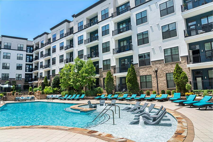 Resort-style pool with sun shelf - 2700 Charlotte Ave Apartments