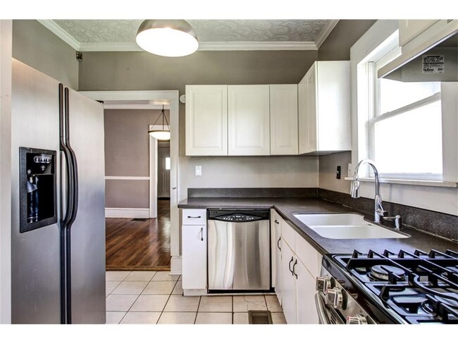 Walk Through Kitchen with a lot of sunlight and all appliances less than 4 years old. - 182 2nd Avenue Southeast
