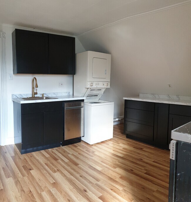 Freshly renovated kitchen with sleek finishes, dishwasher, and plenty of storage - 412 Morris Ave