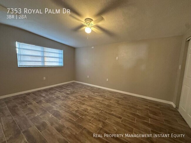 Building Photo - 7353 Royal Palm Dr