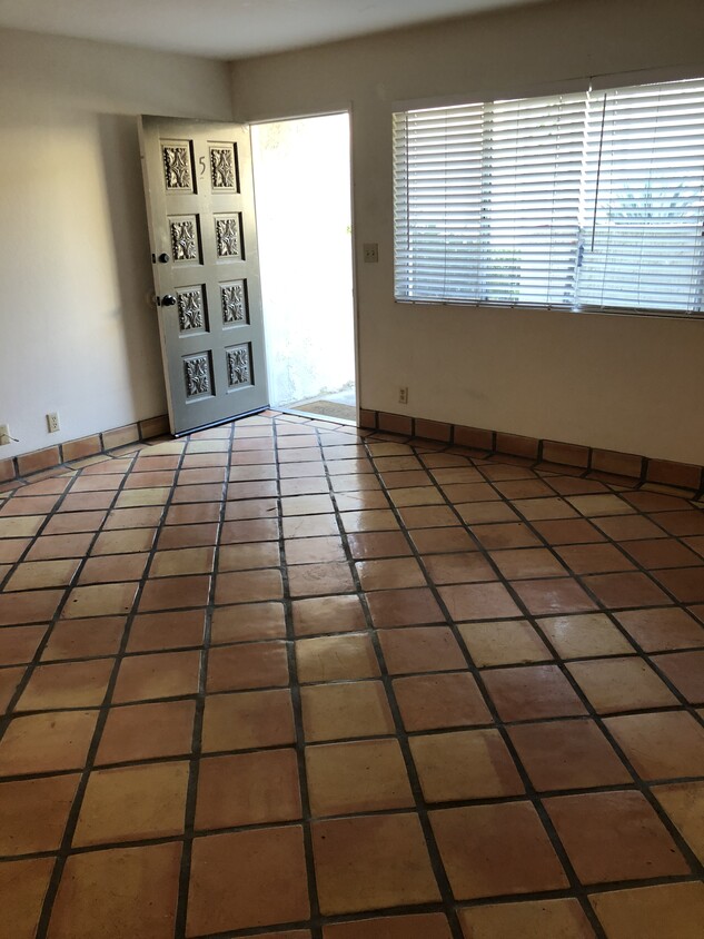 Large living room with Spanish tile floors - 408 Ellwood Beach Dr