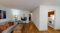 Located at 1201 Moore Ave in Portland, Texas, this single-story home offers a practical and comfortable layout designed for easy everyday living. The living room serves as the heart of the home, featuring warm hardwood-style flooring, neutral walls, and a textured ceiling that adds subtle character. The open feel of the space provides ample room for seating and relaxation. Adjacent to the living area, a dedicated dining space is highlighted by a ceiling fan with light fixture and a window that invites natural light, with direct sight lines into the kitchen. The kitchen is equipped with rich, dark wood cabinetry, granite-style countertops, and a double-basin stainless steel sink, offering functional workspace for meal preparation and a white range for cooking. The bedroom is carpeted for comfort and includes a built-in closet with shelving, providing well-organized storage space. The bathroom features a long vanity with dark wood cabinetry, granite-style countertops, tile flooring, and a shower-tub combination. Throughout the home, consistent finishes and a neutral color palette create a cohesive and inviting atmosphere, making this a well-appointed single-floor residence in Portland, TX.