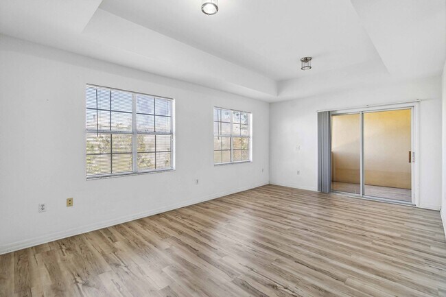 Building Photo - Spacious 1-Bedroom Condo for Annual Rent available now in gated Villagio Community