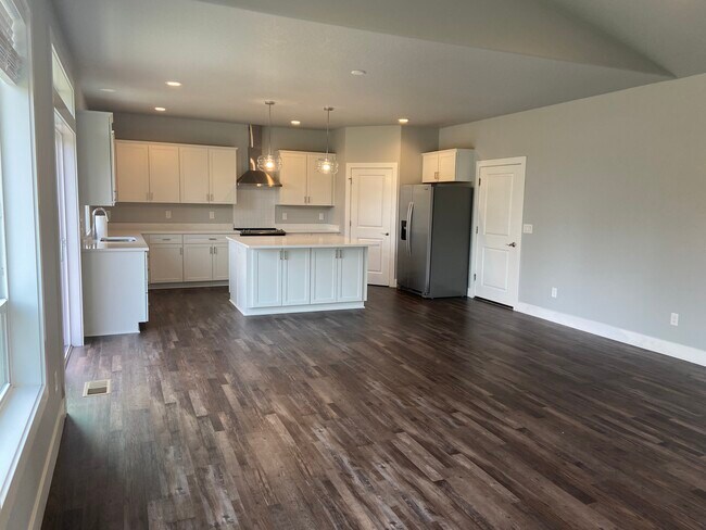 Hardwood flooring for easy cleaning. Island seating. - 1016 NW 56th Way