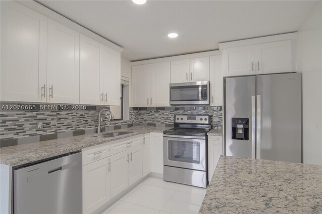 Building Photo - 3745 Cocoplum Cir