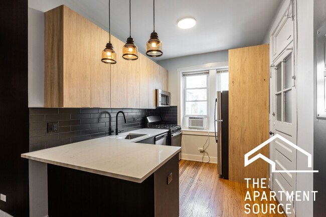 Foto del edificio - 4011 N Lowell Ave