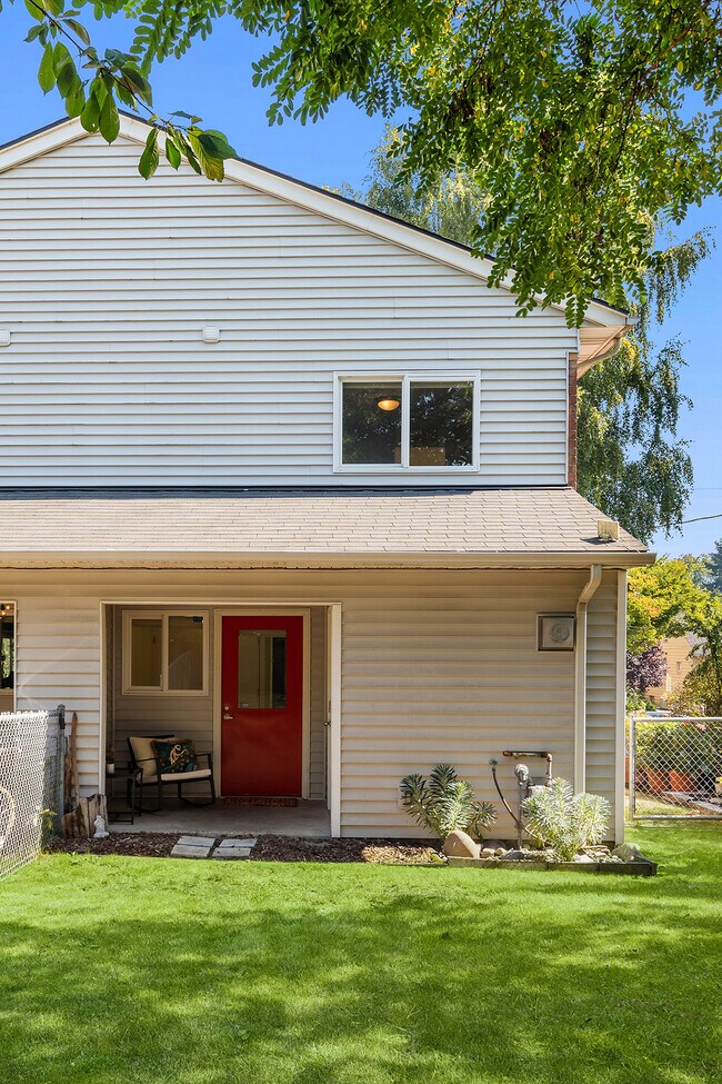 Private Back Garden and covered porch with exterior storage. - 7051 8th Ave NW
