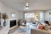 Located at 600 Legacy Dr in Plano, TX, this well-appointed one-bedroom, two-bathroom residence offers a thoughtfully designed single-floor layout. The open-concept living and dining area is bright and welcoming, featuring wood-style flooring, a ceiling fan, a classic fireplace, and sliding glass doors that open to a private outdoor space, allowing natural light to pour in. The kitchen is a standout, boasting white shaker cabinets, a striking quartz-topped peninsula, subway tile backsplash, and stainless steel appliances — a functional and stylish space for cooking and entertaining. The bedroom is comfortably sized, finished with plush carpeting, a natural light-filled window, and access to two closets for ample storage. Two full bathrooms are finished with quartz vanity countertops, white cabinetry, and wood-style flooring, maintaining a clean and modern aesthetic throughout. A dedicated in-unit laundry room with full-size washer and dryer and built-in shelving adds everyday convenience. Neutral tones, consistent finishes, and a practical layout make this residence a well-rounded living space in the heart of Plano.
