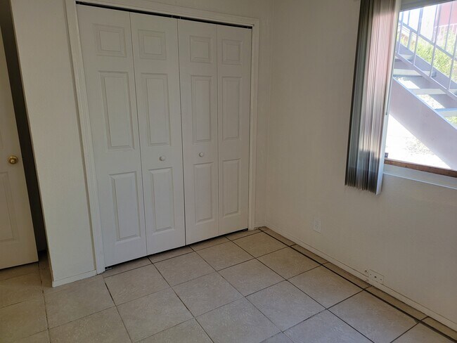Bedroom 2 Sliding Closet - 12805 Dunes Rd SE