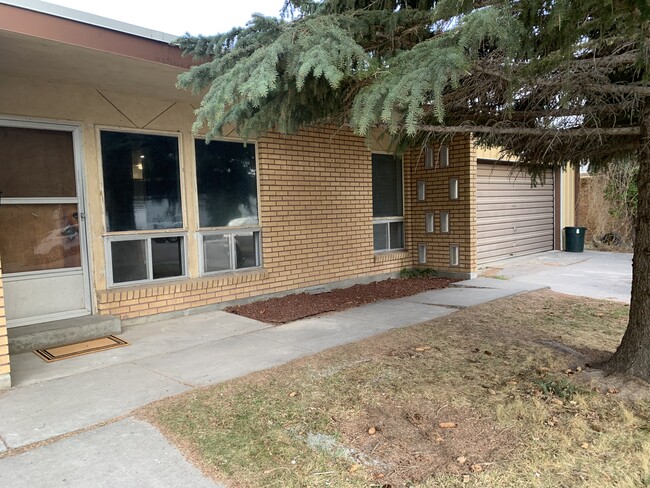 Front of apartment #1/shared garage - 896 Raymond Dr