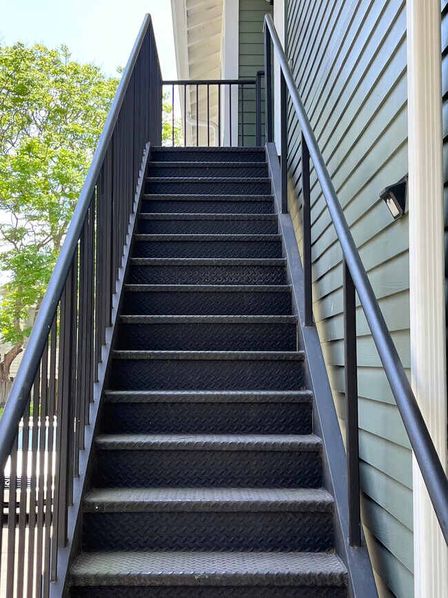 Exterior staircase leading to the apartment - 618 N Carrollton Ave