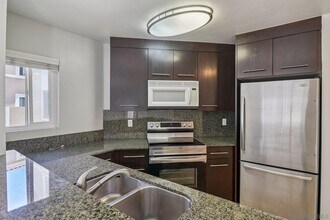 Building Photo - 7565 Charmant Dr