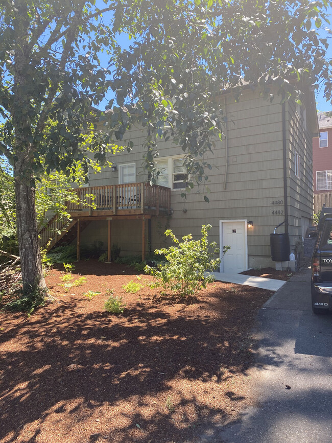 public area - door to basement, parking lot (deck shown is NOT part of lease!) - 4482 SW Pasadena St