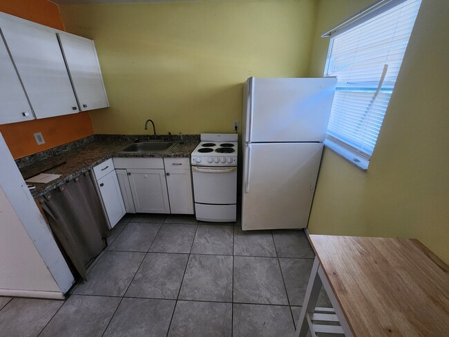 Kitchen. Has ice maker in freezer - 1302 E 149th Ave