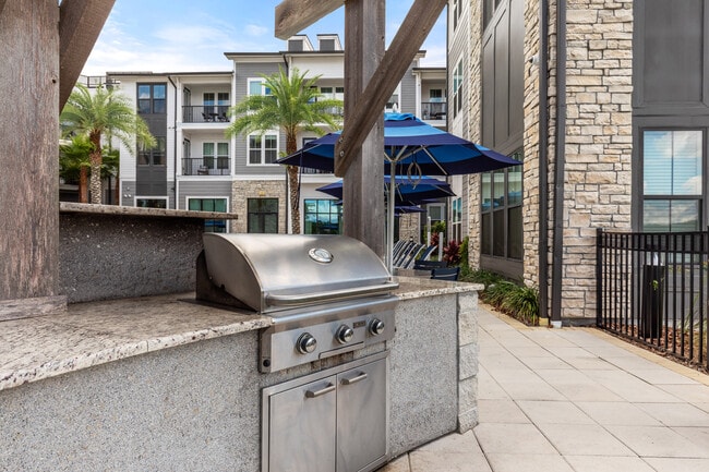 Fire up the grill and enjoy outdoor dining with friends - The Adeline