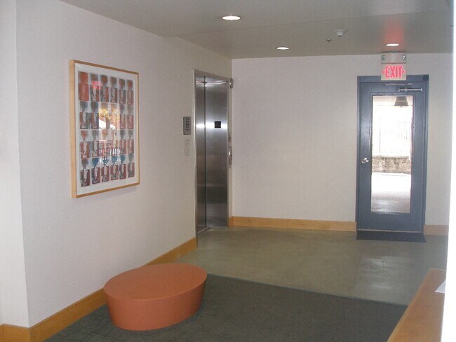 The building lobby with the elevator and door to the parking - 849 Westgate Ave