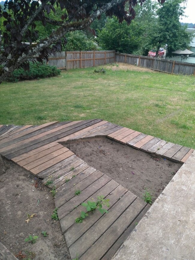 Building Photo - 3 Bedroom 2 Bathroom with 2 car Carport in...