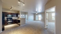 Located at 9701 Pearl St in Thornton, CO, this well-appointed 3-bedroom, 2-bathroom residence offers a functional and comfortable single-floor layout. The open-concept living area flows seamlessly into the kitchen, which is outfitted with rich dark wood cabinetry, granite-style countertops, stainless steel appliances, light hardwood-style flooring, and track lighting that adds a modern touch. A peninsula counter provides additional workspace and a natural transition to the living space.

The three bedrooms are carpeted throughout and feature neutral warm-toned walls, creating a calm and inviting atmosphere. Two of the bedrooms include ceiling fans and windows with exterior views, while the primary bedroom offers a generous footprint. The bathrooms are well-designed with dark vanity cabinetry, granite countertops, light wood-style flooring, and white tile work. The primary bath includes a soaking tub and direct access to a closet, while the secondary bath features a tub-shower combination. Two closets provide ample storage throughout the residence.

A balcony accessible via French doors from the living area offers outdoor space with natural light. The overall design is cohesive and move-in ready, with a neutral color palette throughout.
