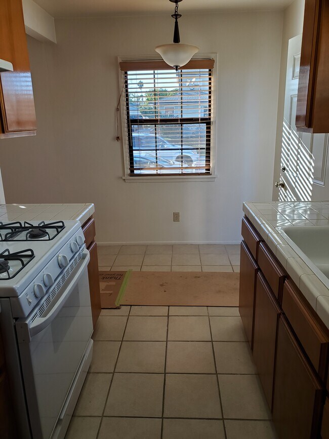 In kitchen facing dining area window, looking West - 8508 Lilienthal Ave