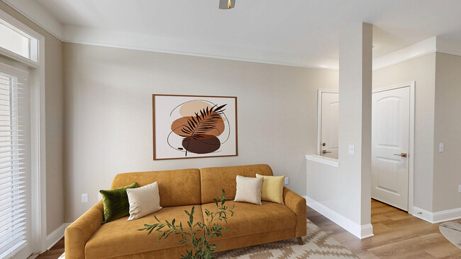 Sala de estar recientemente renovada con pisos estilo madera - Creekstone at RTP Apartments