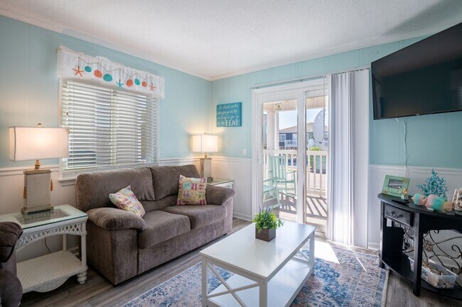 Foto del edificio - THIS OFF-SEASON MONTHLY RENTAL WILL HELP WITH THOSE WINTER BLUES