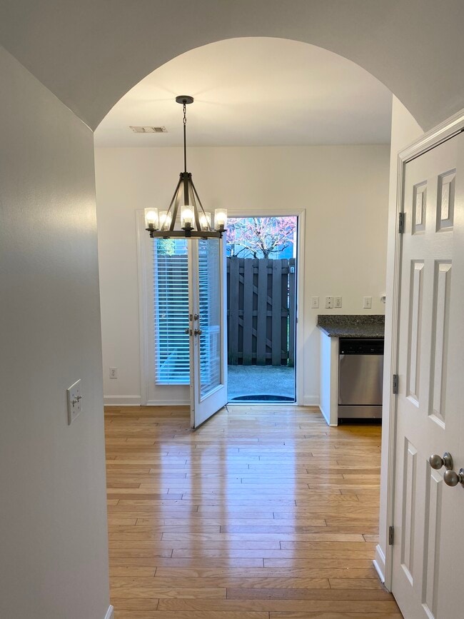 Additional view from living room into your kitchen and patio outside. - 809 Benton Ave